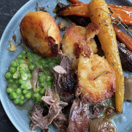 SLOW-COOKED LAMB WITH POMEGRANATE MOLASSES AND HONEY GLAZED CARROTS